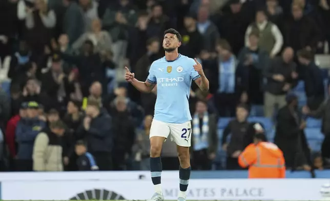 Manchester City's Matheus Nunes celebrates after scoring his side's second goal during the English Premier League soccer match between Manchester City and Aston Villa at Etihad stadium in Manchester, England, Tuesday, April 22, 2025. (AP Photo/Jon Super)