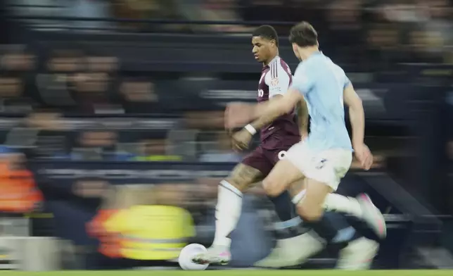 Aston Villa's Marcus Rashford in action during the English Premier League soccer match between Manchester City and Aston Villa at Etihad stadium in Manchester, England, Tuesday, April 22, 2025. (AP Photo/Jon Super)