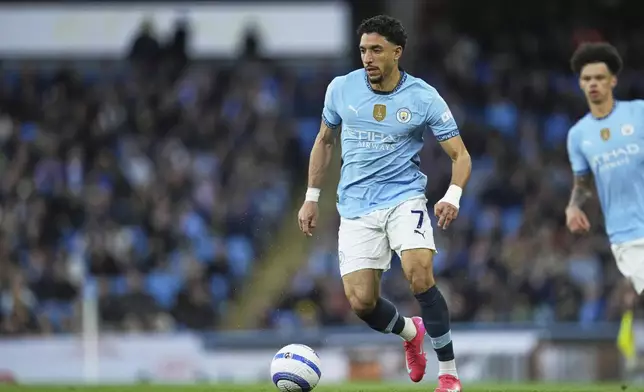 Manchester City's Omar Marmoush in action during the English Premier League soccer match between Manchester City and Aston Villa at Etihad stadium in Manchester, England, Tuesday, April 22, 2025. (AP Photo/Jon Super)