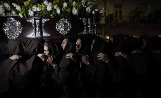 Catholics carry a statue of Jesus Christ at a Holy Week procession in Panama City's Casco Viejo, Friday, April 18, 2025. (AP Photo/Matias Delacroix)