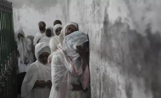 Ethiopian Orthodox Christian worshippers visit the Church of the Holy Sepulcher, the place where Christians believe Jesus Christ was crucified, buried and resurrected, in the Old City of Jerusalem on Holy Thursday, April 17, 2025. (AP Photo/Mahmoud Illean)