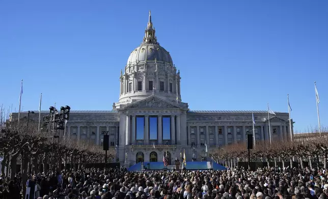 FILE - The crowd watches as Mayor Daniel Lurie, center, delivers his inaugural address outside City Hall, Wednesday, Jan. 8, 2025, in San Francisco. (AP Photo/Godofredo A. Vásquez, File)