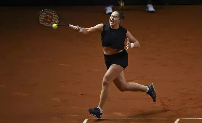 Jelena Ostapenko of Latvia in action against Aryna Sabalenka of Belarus during the women's singles final tennis match of the WTA tour, in Stuttgart, Germany, Moday, April 21, 2025. (Marijan Murat/dpa via AP)