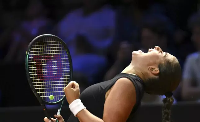 Latvia's Jelena Ostapenko celebrates after her victory against Belarus' Aryna Sabalenka during the women's singles final tennis match of the WTA tour, in Stuttgart, Germany, Monday, April 21, 2025. (Marijan Murat/dpa via AP)