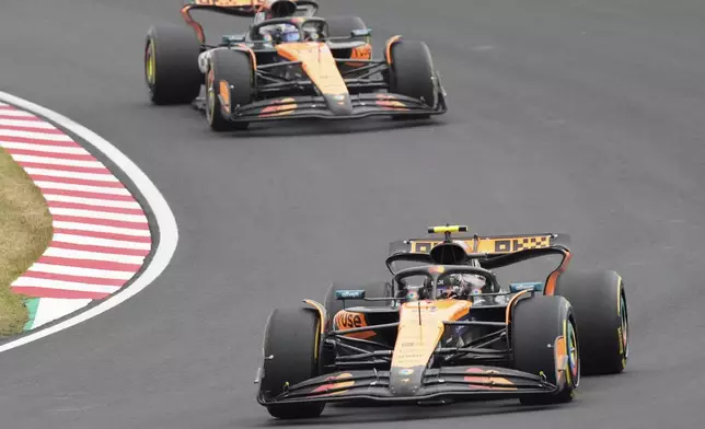 McLaren driver Lando Norris of Britain leadsMcLaren driver Oscar Piastri of Australia during the Japanese Formula One Grand Prix at the Suzuka Circuit in Suzuka, central Japan, Sunday, April 6, 2025. (AP Photo/Hiro Komae)