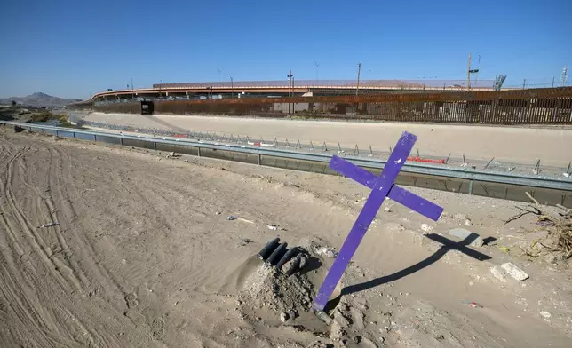 FILE - A cross stands on the Mexican side of the border with the United States hours before President-elect Donald Trump's inauguration, Jan. 19, 2025, in Ciudad Juarez, Mexico. (AP Photo/Andres Leighton, File)