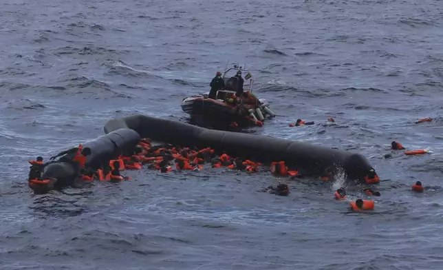 FILE - Refugees and migrants are rescued by members of the Spanish NGO Proactiva Open Arms in the Mediterranean Sea on Nov. 11, 2020. (AP Photo/Sergi Camara, File)