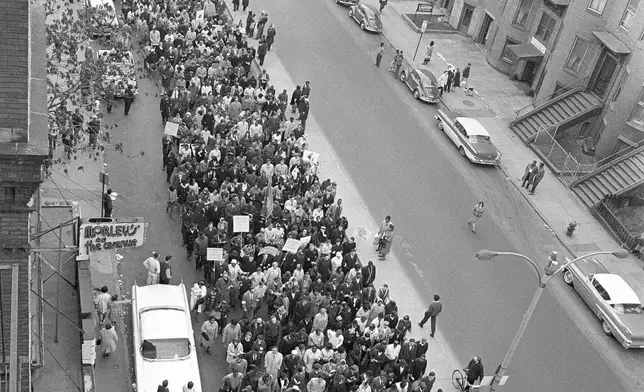 FILE - Civil rights marchers parade down Columbus Ave. in Boston led by Dr. Martin Luther King Jr., en route to historic Boston Common, April 25, 1965. (AP Photo, file)