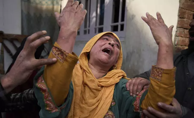 A relative of Ahsan Ul Haq Shiekh, a militant who officials say is involved in the deadly attack on tourists in Pahalgam, wails after Indian forces blew up the family home at Murran village in Pulwama, south of Srinagar, Indian controlled Kashmir, Saturday, April 26, 2025. (AP Photo/Dar Yasin)