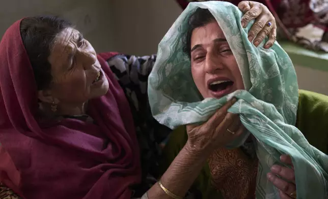 Relatives of Ahsan Ul Haq Shiekh, a militant who officials say is involved in the deadly attack on tourists in Pahalgam, wail after after Indian forces blew up the family home at Murran village in Pulwama, south of Srinagar, Indian controlled Kashmir, Saturday, April 26, 2025. (AP Photo/Dar Yasin)