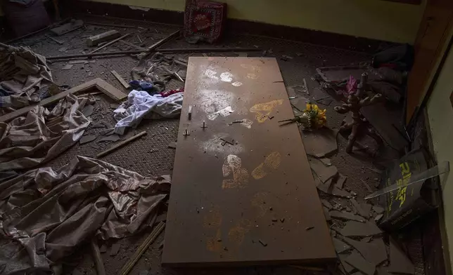 The damage in a neighbouring house is seen after Indian forces blew up the family home of Ahsan Ul Haq Shiekh, a militant who officials say is involved in the deadly attack on tourists in Pahalgam, at Murran village in Pulwama, south of Srinagar, Indian controlled Kashmir, Saturday, April 26, 2025. (AP Photo/Dar Yasin)