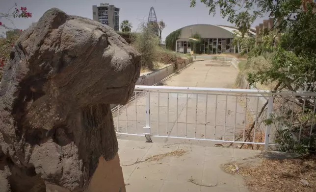 A Meroitic lion statue is seen in the garden of Sudan National Museum, the home to the country's largest artifacts that date to different eras of Sudanese history, after nearly two years of war between the army and paramilitary Rapid Support Forces (RSF), in Khartoum, Sudan, Thursday, April 3, 2025. (AP Photo/Khaled Abd Al Gader)