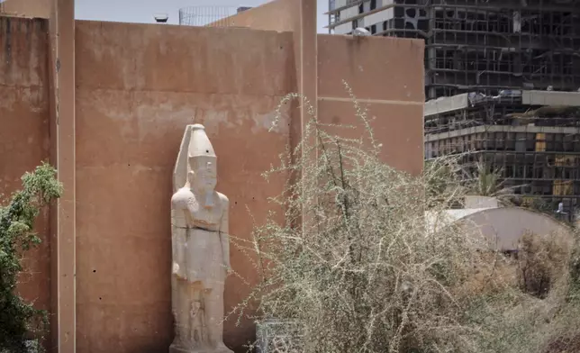 A granite colossal statue from the ancient temple of Tabo on Argo Island stands despite the damage at the Sudan National Museum, the home to the country's largest artifacts that date to different eras of Sudanese history, after nearly two years of war between the army and paramilitary Rapid Support Forces (RSF), in Khartoum, Sudan, Thursday, April 3, 2025. (AP Photo/Khaled Abd Al Gader)