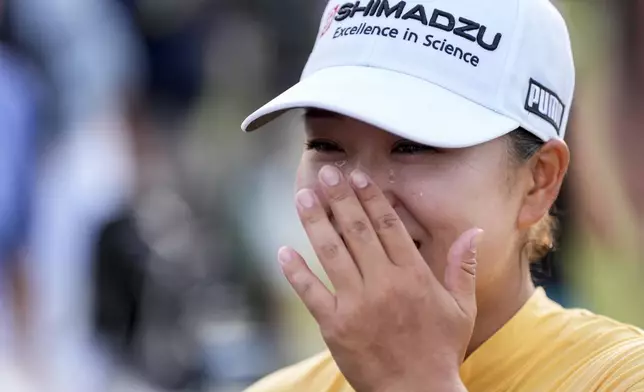 Mao Saigo, of Japan, celebrates winning the Chevron Championship LPGA golf tournament Sunday, April 27, 2025, in The Woodlands, Texas. (AP Photo/Ashley Landis)