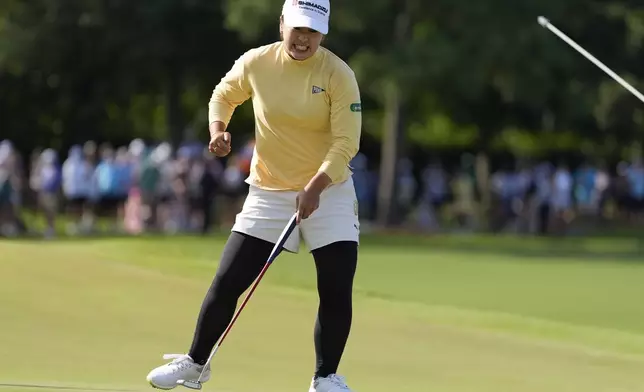 Mao Saigo, of Japan, celebrates her birdie putt on the 18th green during a playoff of the Chevron Championship LPGA golf tournament Sunday, April 27, 2025, in The Woodlands, Texas. (AP Photo/Ashley Landis)