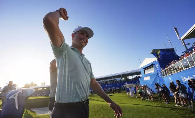 Ben Griffin, 18th green Andrew Novak, after winning the PGA Zurich Classic golf tournament with teammate Andrew Novak at TPC Louisiana in Avondale, La., Sunday, April 27, 2025. (AP Photo/Gerald Herbert)