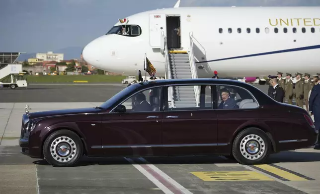 King Charles III, right, and Queen Camilla, not visible, arrive at Rome's International Airport G.B. Pastine in Ciampino for a four-day official visit to Italy, Monday, April 7, 2025. (AP Photo/Andrew Medichini)