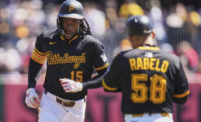 Pittsburgh Pirates' Oneil Cruz (15) rounds third after hitting a solo home run off Washington Nationals pitcher Trevor Williams (32) to lead off the baseball game in Pittsburgh, Thursday, April 17, 2025. (AP Photo/Gene J. Puskar)