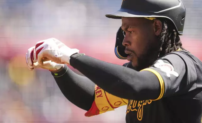 Pittsburgh Pirates' Oneil Cruz returns to the dugout after hitting a solo home run off Washington Nationals pitcher Trevor Williams (32) to lead off the baseball game in Pittsburgh, Thursday, April 17, 2025. (AP Photo/Gene J. Puskar)