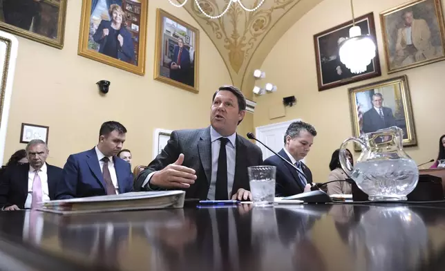 House Budget Committee Chairman Jodey Arrington, R-Texas, joined at right by Rep. Brendan Boyle, D-Pa., the ranking member, defends the Republican plan to advance President Donald Trump's top domestic priorities on spending reductions and tax breaks as the House Rules Committee prepares the measure for a floor vote, at the Capitol in Washington, Wednesday, April 9, 2025. (AP Photo/J. Scott Applewhite)