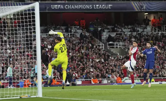 PSG's Goncalo Ramos, right, attempts a shot at goal and hits the bar during the Champions League semifinal first leg soccer match between Arsenal and Paris Saint-Germain at Arsenal Stadium in London, England, Tuesday, April 29, 2025. (AP Photo/Kin Cheung)