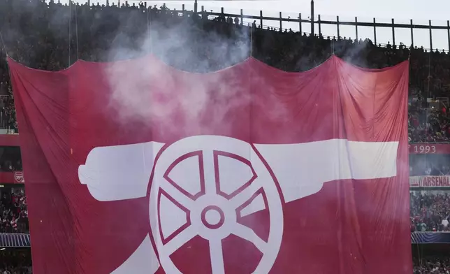 Arsenal fans hang a banner during the Champions League semifinal first leg soccer match between Arsenal and Paris Saint-Germain at Arsenal Stadium in London, England, Tuesday, April 29, 2025. (AP Photo/Kin Cheung)