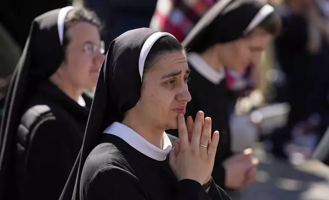 Nuns attend the funeral of Pope Francis in St. Peter's Square at the Vatican, Saturday, April 26, 2025. (AP Photo/Andreea Alexandru)
