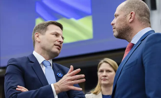 Belgium's Defense Minister Theo Francken, right, talks with Estonia's Defense Minister Hanno Pevkur during a coalition of the willing defence ministers meeting at NATO headquarters in Brussels, Belgium, Thursday, April 10, 2025. (AP Photo/Geert Vanden Wijngaert)