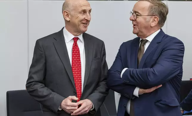 Britain's Defense Secretary John Healey, left, talks with Germany's Defense Minister Boris Pistorius during a meeting of the Ukraine Defense Contact Group at NATO headquarters in Brussels, Friday, April 11, 2025. (AP Photo/Geert Vanden Wijngaert)