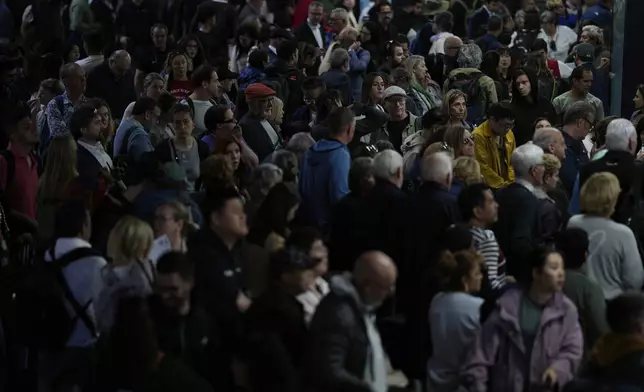 Passengers inside Atocha train station the day after a major power outage in Madrid, Tuesday, April 29, 2025. (AP Photo/Manu Fernandez)