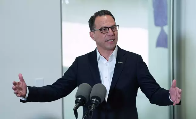 Pennsylvania Gov. Josh Shapiro visits the Hershey Company's new manufacturing plant in Hershey, Pa., Wednesday, April 16, 2025. (AP Photo/Matt Rourke)