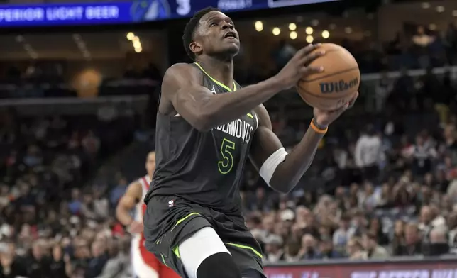 Minnesota Timberwolves guard Anthony Edwards (5) drives to the basket in the first half of an NBA basketball game against the Memphis Grizzlies, Thursday, April 10, 2025, in Memphis, Tenn. (AP Photo/Brandon Dill)