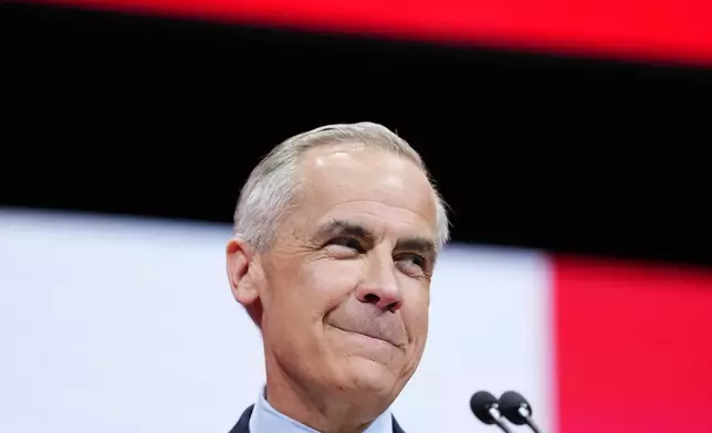 Canadian Prime Minister Mark Carney speaks to supporters on stage at his campaign headquarters after the Liberal Party won the Canadian election in Ottawa, Ontario, Tuesday, April 29, 2025. (Justin Tang/The Canadian Press via AP)