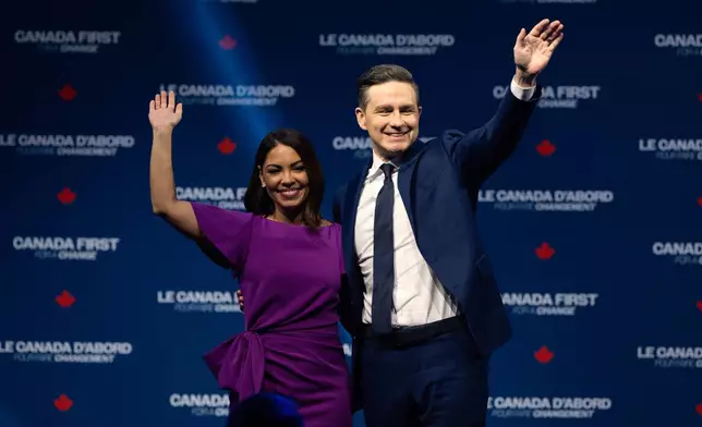 Conservative Leader Pierre Poilievre and his wife Anaida Poilievre wave as they leave the stage Tuesday, April 29, 2025 in Ottawa. (Adrian Wyld/The Canadian Press via AP)