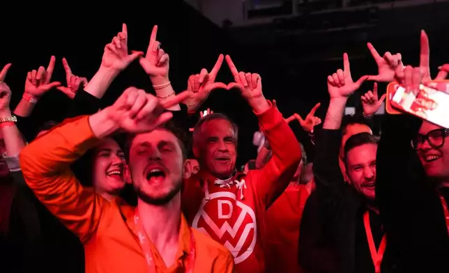 Canadian Prime Minister Mark Carney, center, dances to Canadian band Down With Webster as they play live at campaign headquarters after the Liberal Party won the Canadian election in Ottawa on Tuesday, April 29, 2025. (Sean Kilpatrick/The Canadian Press via AP)