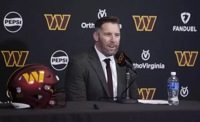 Washington Commanders general manager Adam Peters prepares to introduce first-round draft pick offensive tackle Josh Conerly Jr. during an NFL football news conference in Ashburn, Va., Friday, April 25, 2025. (AP Photo/Luis M. Alvarez)