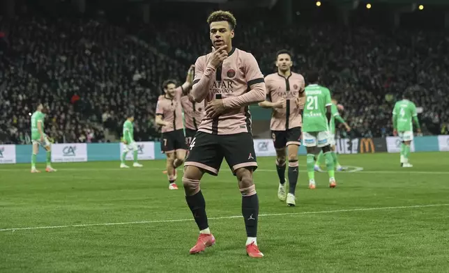 PSG's Desire Doue celebrates after scoring during the French League One soccer match between Saint-Etienne and Paris Saint Germain at the Geoffroy-Guichard stadium in Saint-Etienne, France, Saturday, March 29, 2025. (AP Photo/Laurent Cipriani)