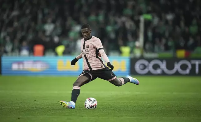 PSG's Ousmane Dembele kicks the ball during the French League One soccer match between Saint-Etienne and Paris Saint Germain at the Geoffroy-Guichard stadium in Saint-Etienne, France, Saturday, March 29, 2025. (AP Photo/Laurent Cipriani)