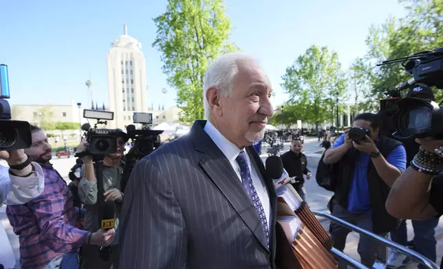 Attorney Mark Geragos arrives for a hearing regarding the case of Erik and Lyle Menendez Friday, April 11, 2025, in Los Angeles. (AP Photo/Damian Dovarganes)