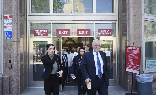 Attorney Mark Geragos exits for a lunch break during a hearing regarding the case of Erik and Lyle Menendez Friday, April 11, 2025, in Los Angeles. (AP Photo/Damian Dovarganes)