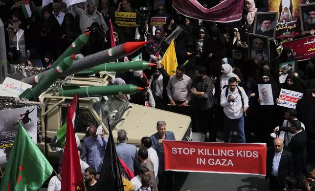 Replicas of some missiles are carried on a truck during an anti-Israel demonstration at the Felestin (Palestine) Sq. in Tehran, Iran, Wednesday, April 9, 2025. (AP Photo/Vahid Salemi)