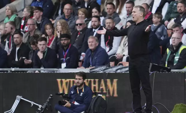 Wrexham's Manager Phil Parkinson reacts during the English League One soccer match between Wrexham and Charlton Athletic at the Racecourse ground in Wrexham, Wales, Saturday, April 26, 2025. (AP Photo/Jon Super)