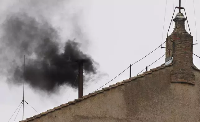 FILE - Black smoke emerges from the chimney on the Sistine Chapel as cardinals voted on the second day of the conclave to elect a pope in St. Peter's Square at the Vatican, Wednesday, March 13, 2013. (AP Photo/Michael Sohn, File)