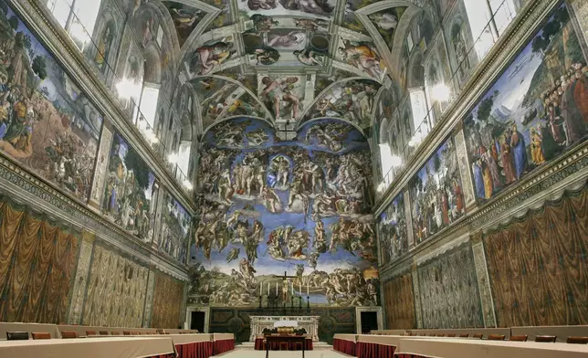 FILE - Tables and chairs line the Sistine Chapel at the Vatican in preparation for the conclave, on April 16, 2005. (AP Photo/Pier Paolo Cito, File)