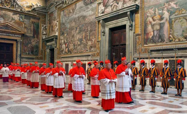 FILE - In this photo from files taken on April 18, 2005 and released by the Vatican paper L'Osservatore Romano, Cardinals walk in procession to the Sistine Chapel at the Vatican, at the beginning of the conclave. (Osservatore Romano via AP, File)