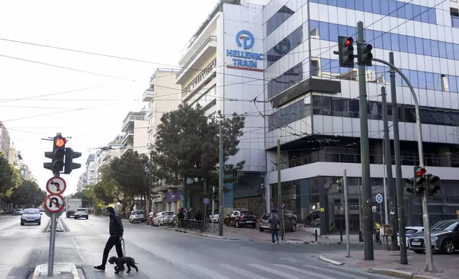 The logo of Hellenic Train, Greece's main railway company, is seen outside company's headquarters, following a bomb explosion Friday night causing causing limited damage but no injuries, in Athens, Greece, on Saturday, April 12, 2025. (AP Photo/Yorgos Karahalis)