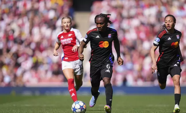 Lyon's Melchie Dumornay runs with the ball during the women's Champions League semifinals, first leg, soccer match between Arsenal FC and Olympique Lyonnais at the Arsenal Stadium, in London, Saturday, April 19, 2025. (AP Photo/Kirsty Wigglesworth)