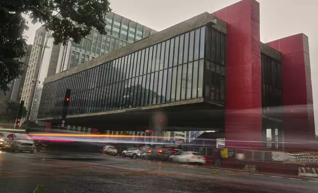 Vehicles drive past the Sao Paulo Art Museum or MASP, in Sao Paulo, Thursday, April 10, 2025. (AP Photo/Andre Penner)