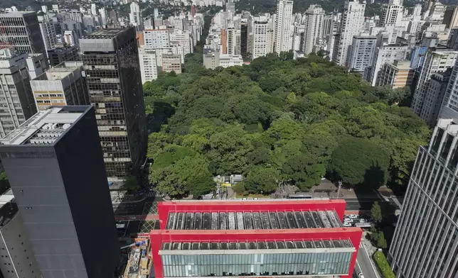 An aerial view of the Sao Paulo Art Museum or MASP, and its new building, the black tall tower on the left, in Sao Paulo, Thursday, April 10, 2025. (AP Photo/Andre Penner)