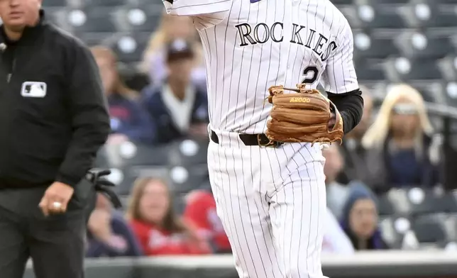 Colorado Rockies third baseman Ryan McMahon (24) throws to first base for an out in the first inning of a baseball game against the Atlanta Braves, Tuesday, April 29, 2025, in Denver. (AP Photo/Geneva Heffernan)